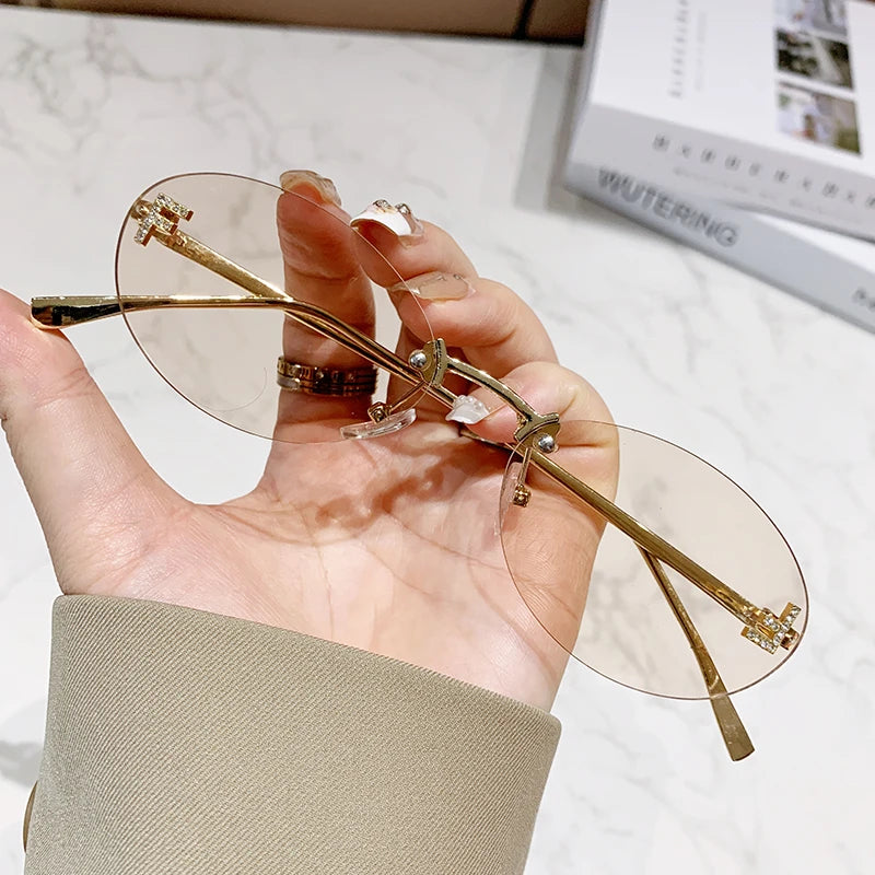 Oval Rimless UV400 Sunglasses Women Small Metal Frame Fashion Outdoor Shades